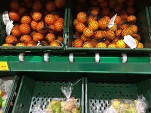 Plastic runners allow crates to be easily merchandised in the display.